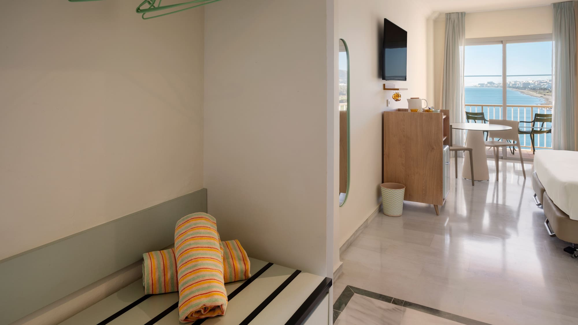 a room with a television and a bed