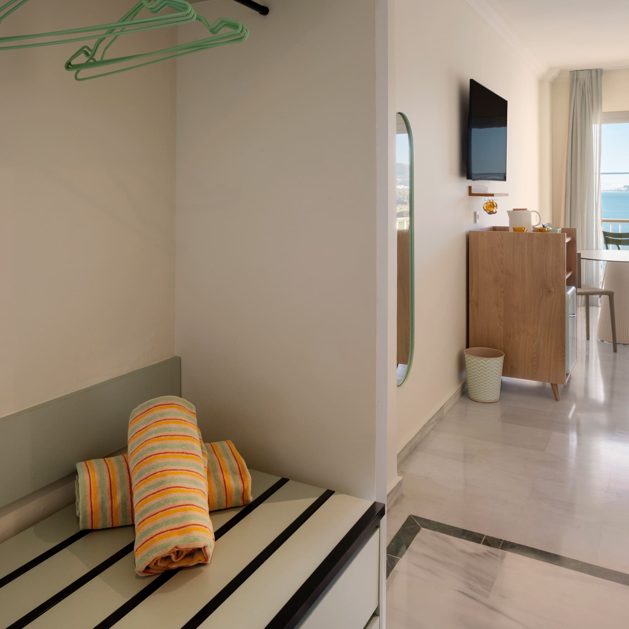 a room with a television and a bed