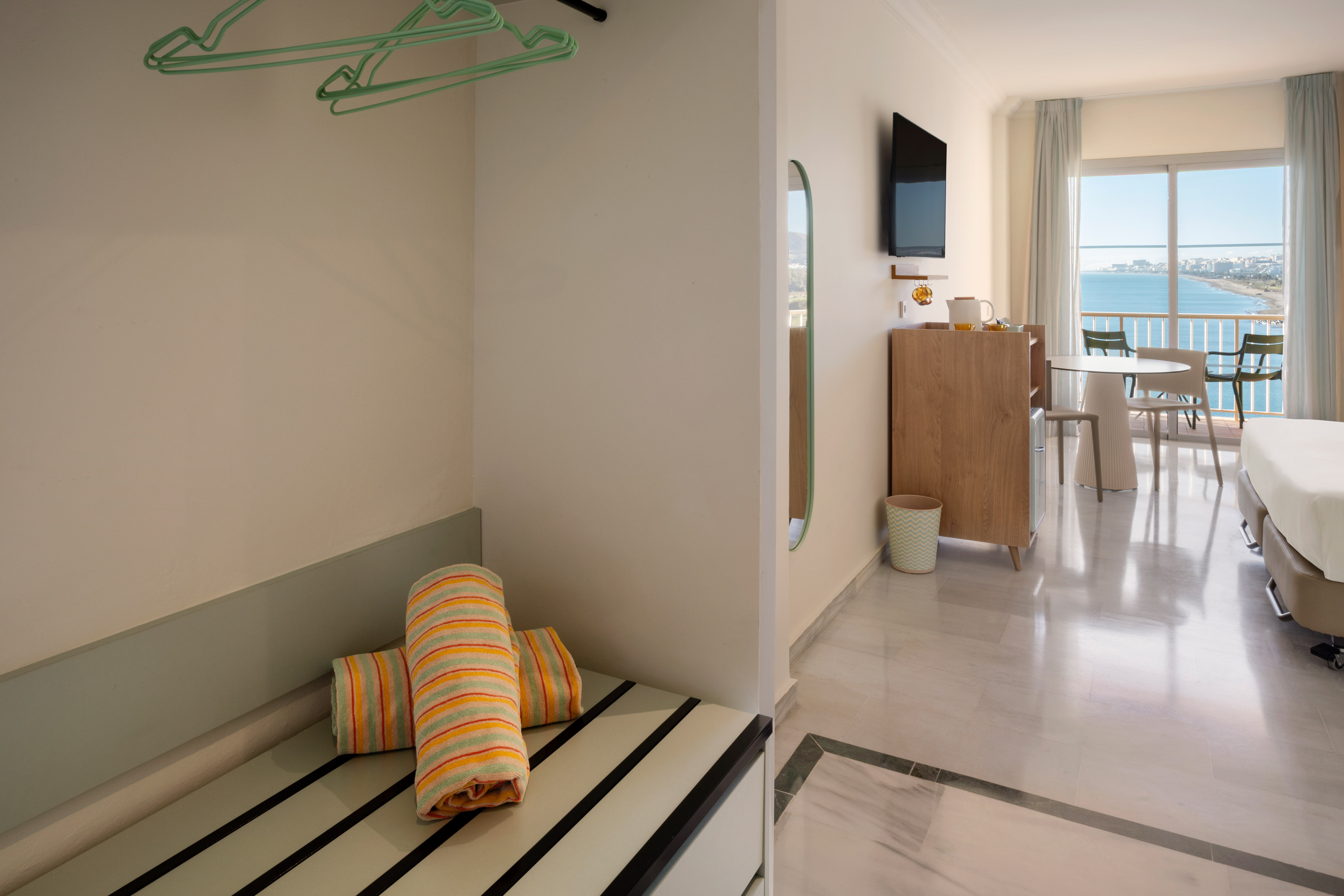 a room with a television and a bed