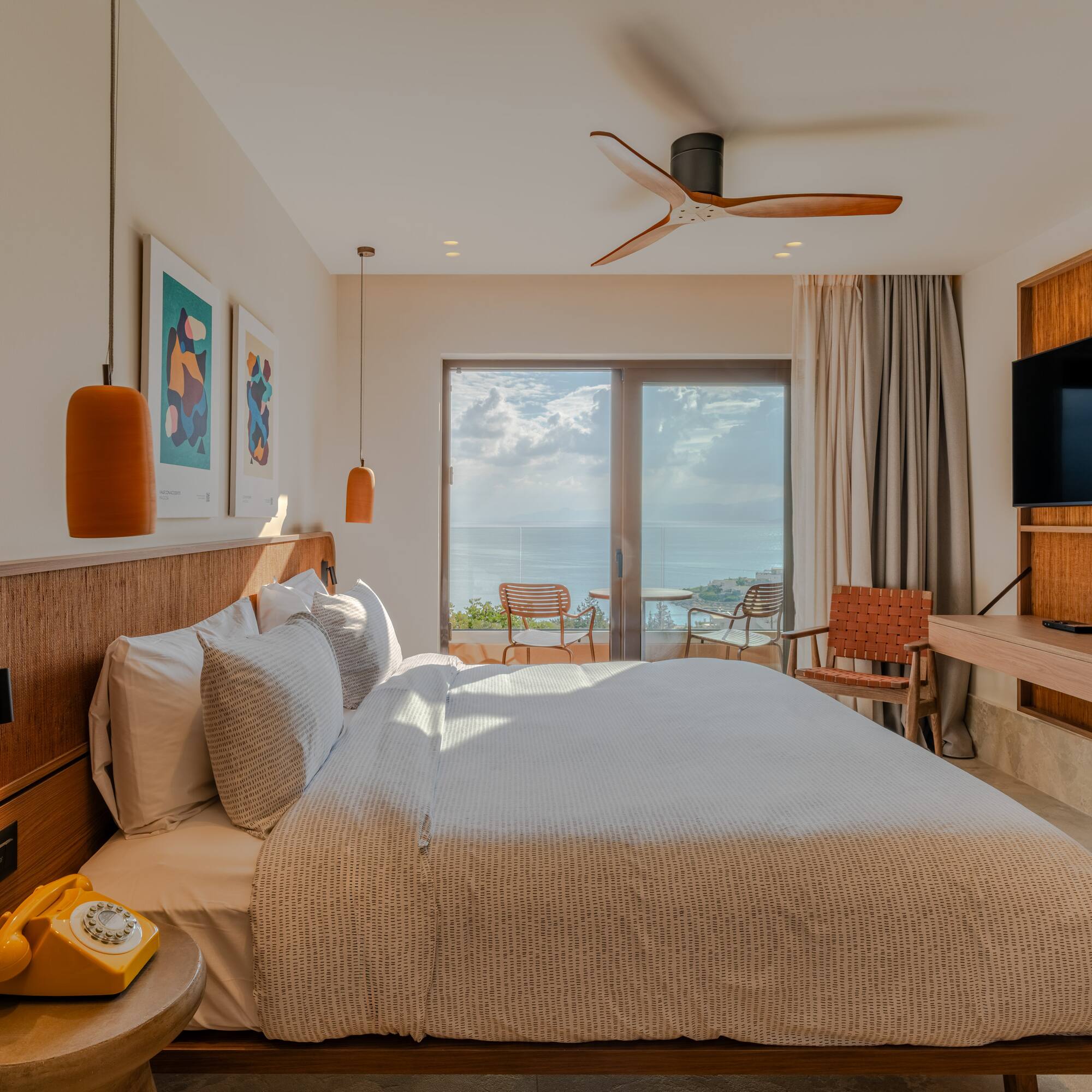 a bedroom with a television and a bed