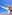 Joyful couple embracing and smiling outdoors under a blue sky.
