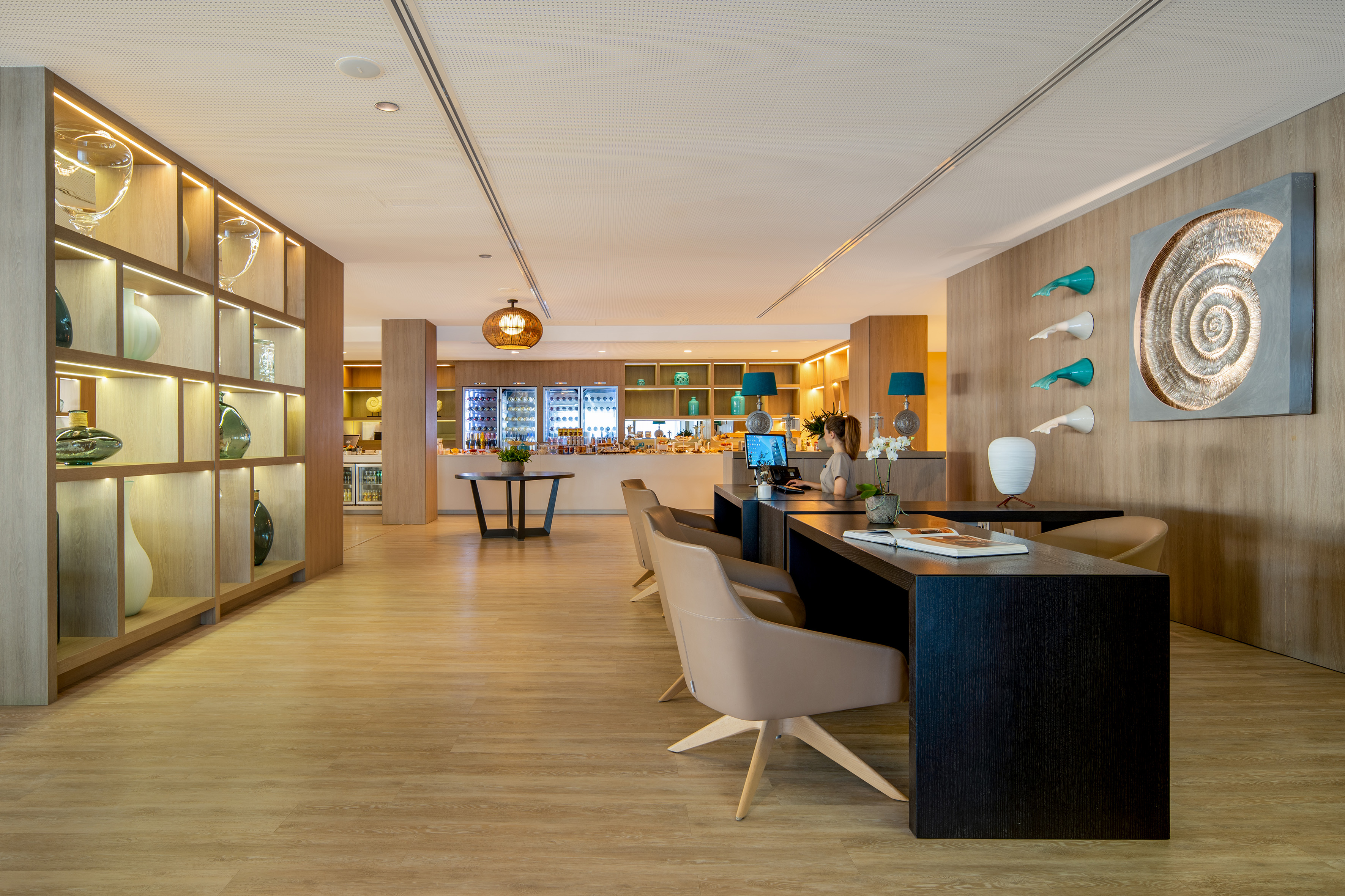 Modern hotel reception and buffet area with stylish wood design and decor.