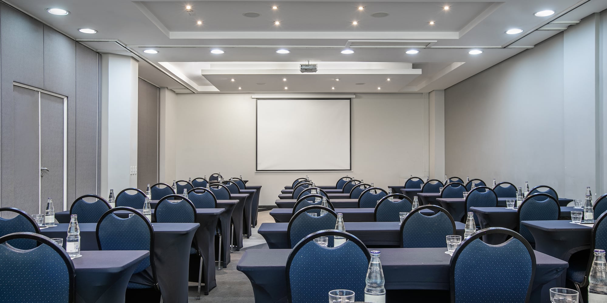 a room with tables and chairs