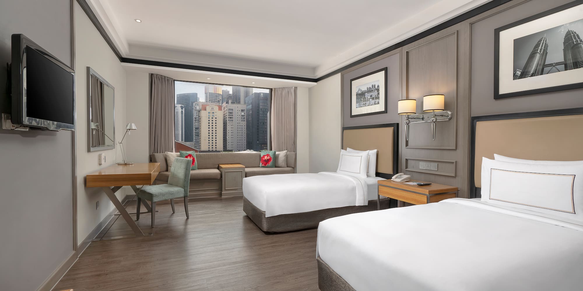 a room with two beds and a desk