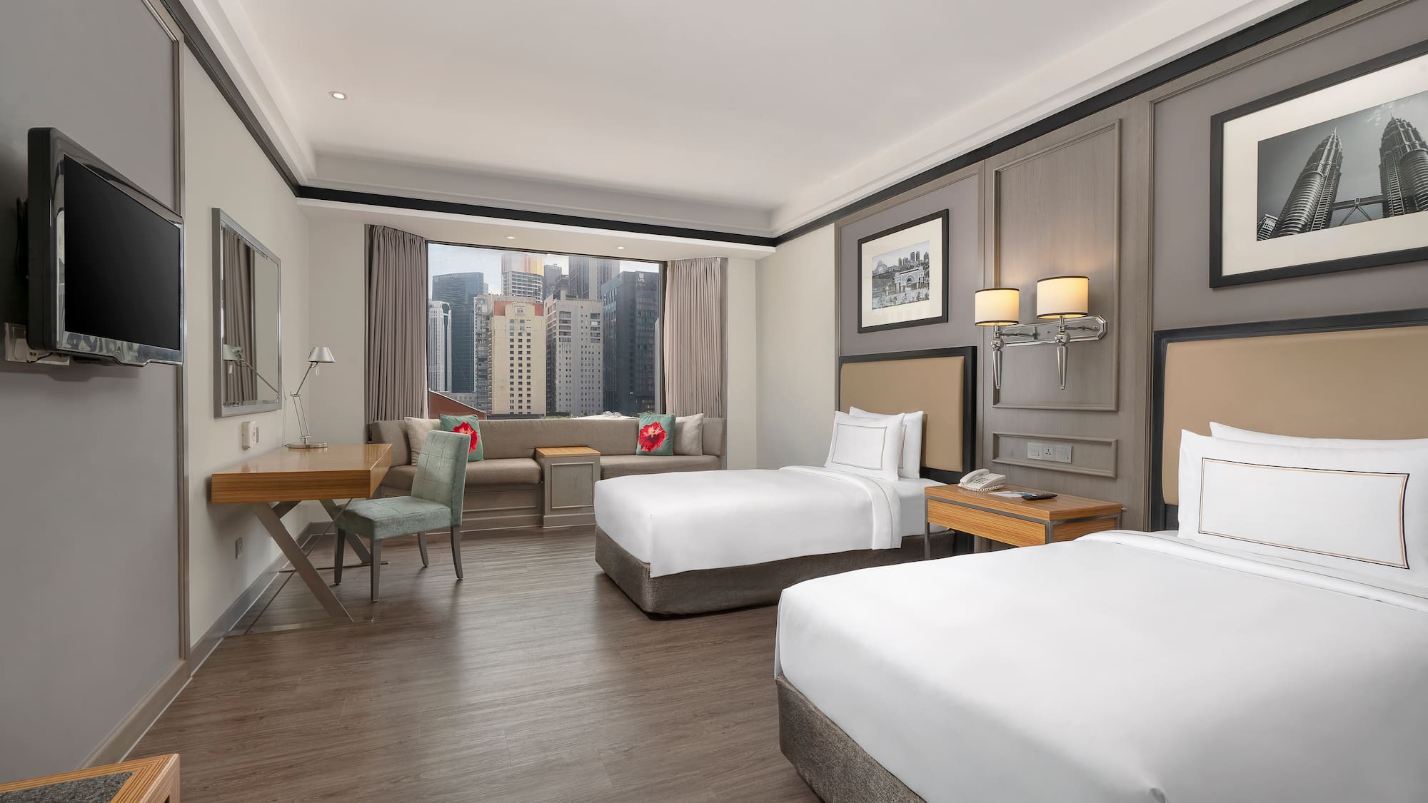 a room with two beds and a desk