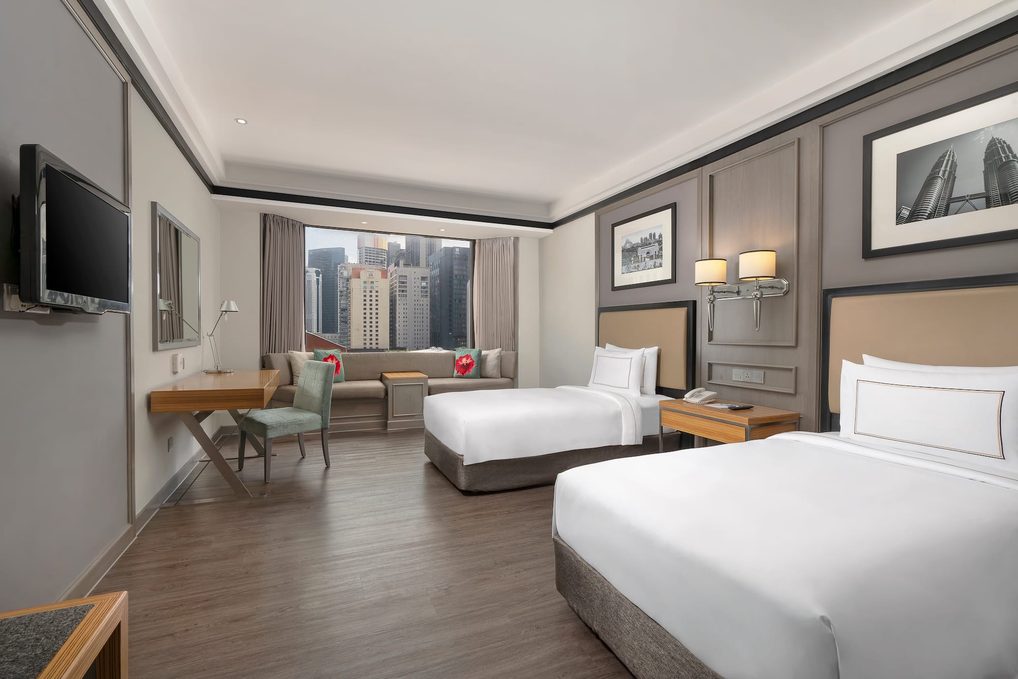 a room with two beds and a desk