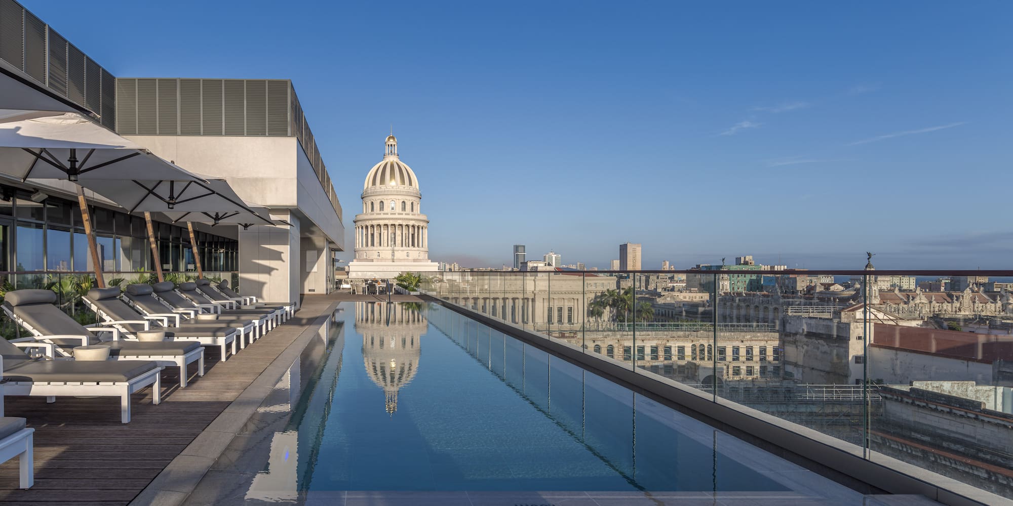 a pool with a large building in the background