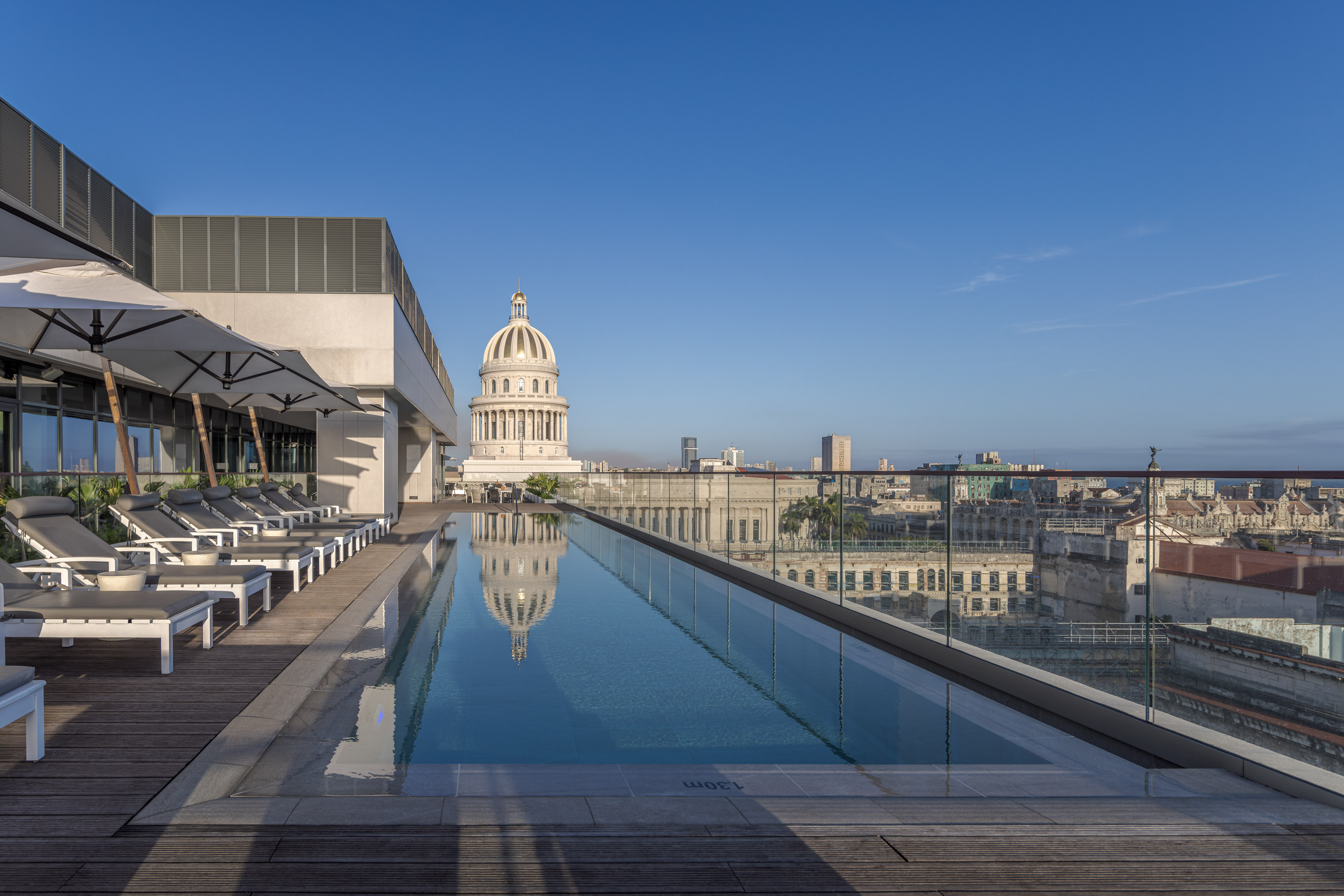 a pool with a large building in the background