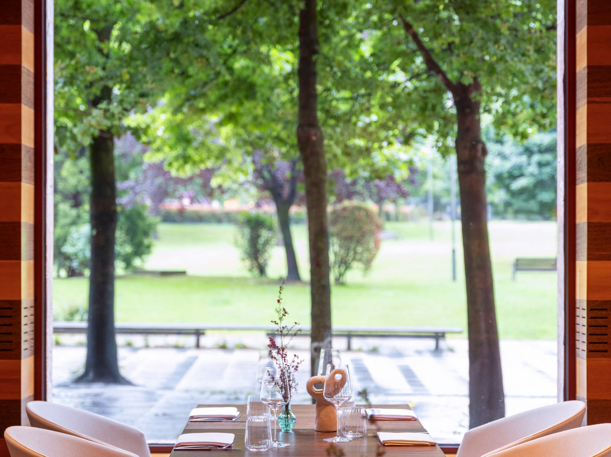 a table with chairs and a large window