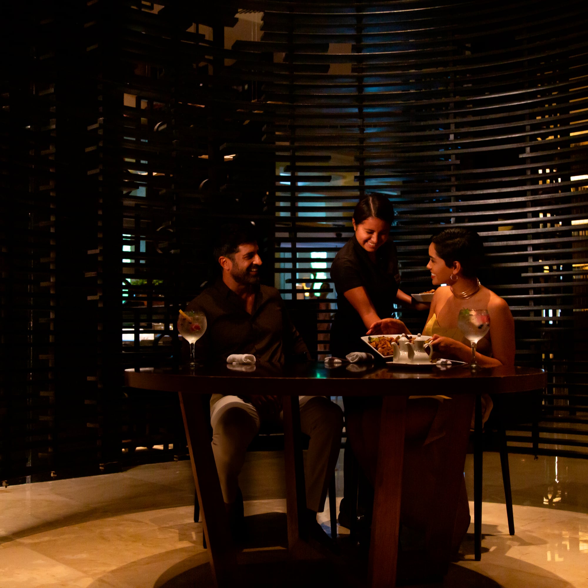 a group of people sitting at a table