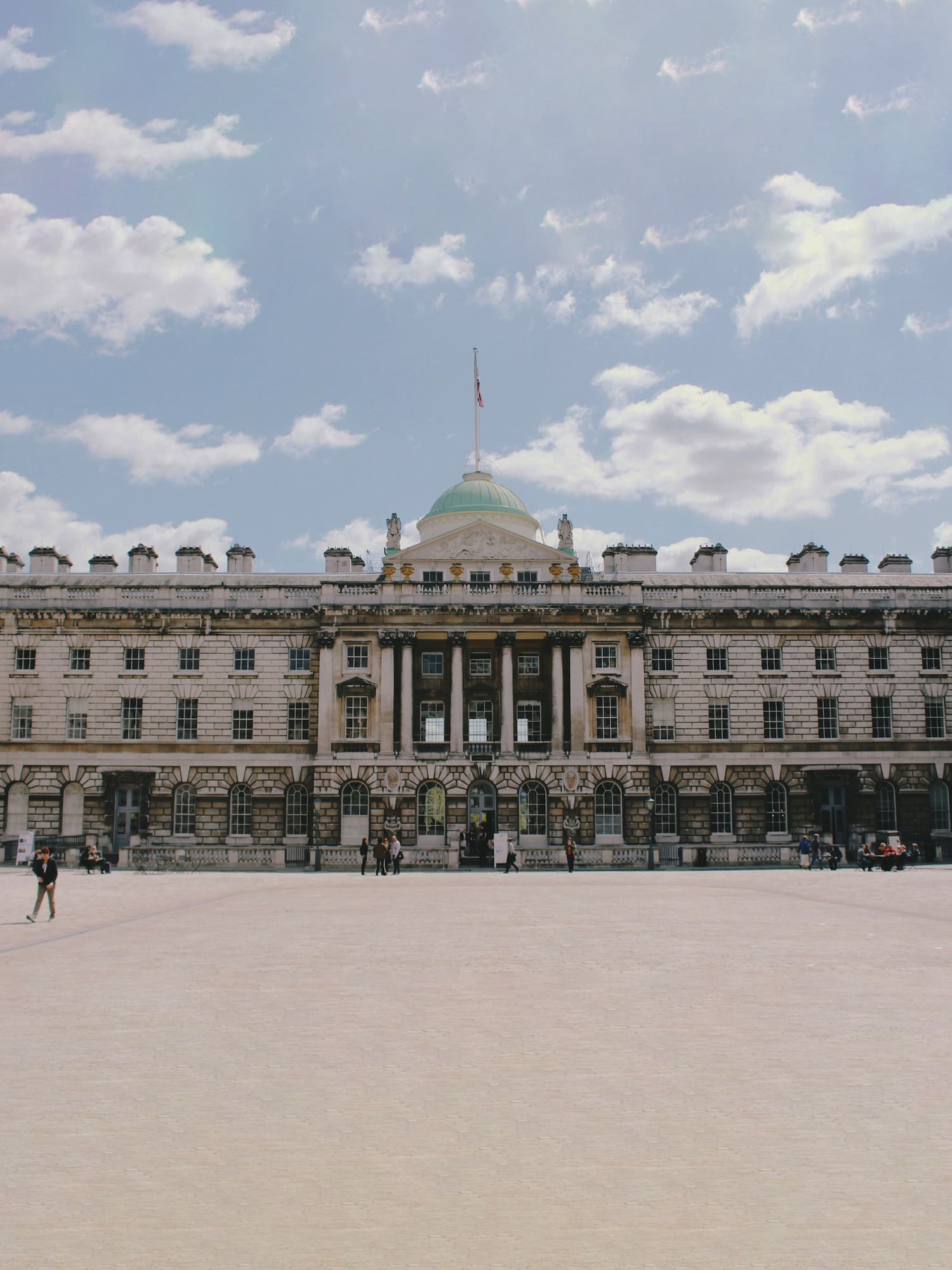 a large building with a flag on top
