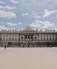 a large building with a flag on top