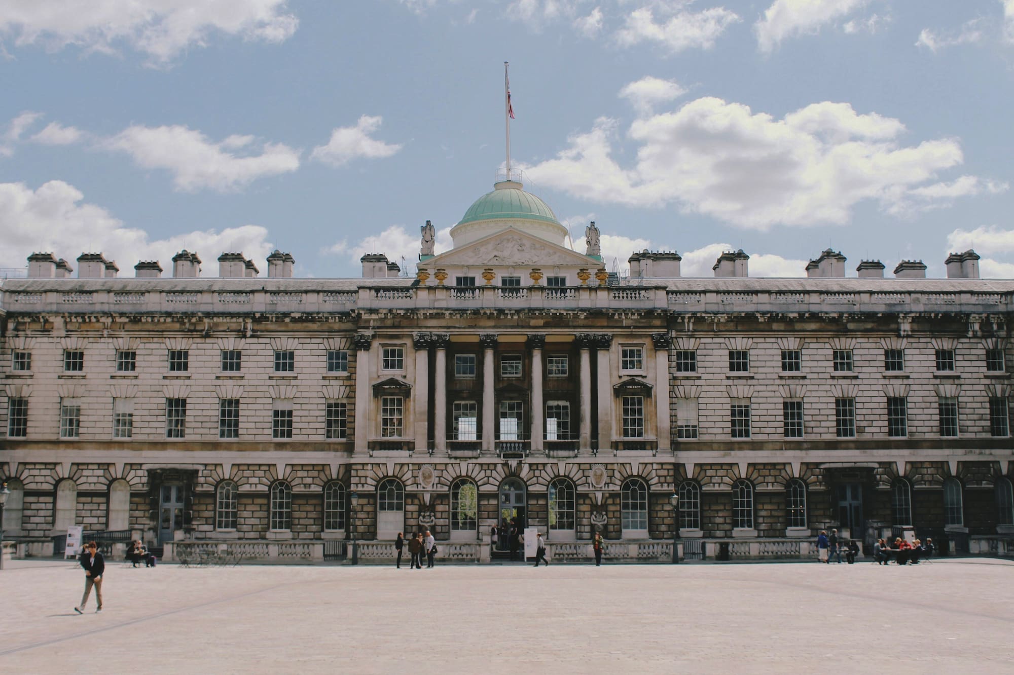 a large building with a flag on top