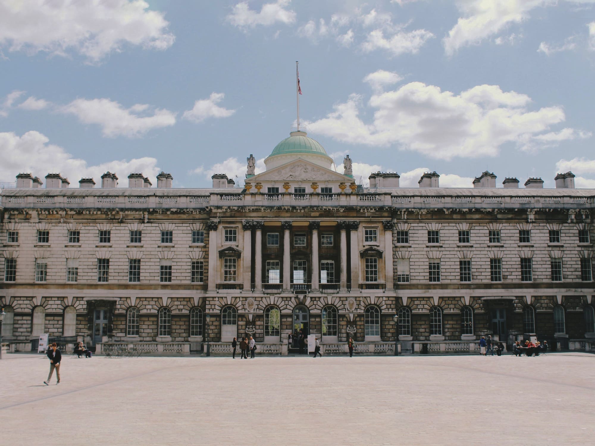 a large building with a flag on top