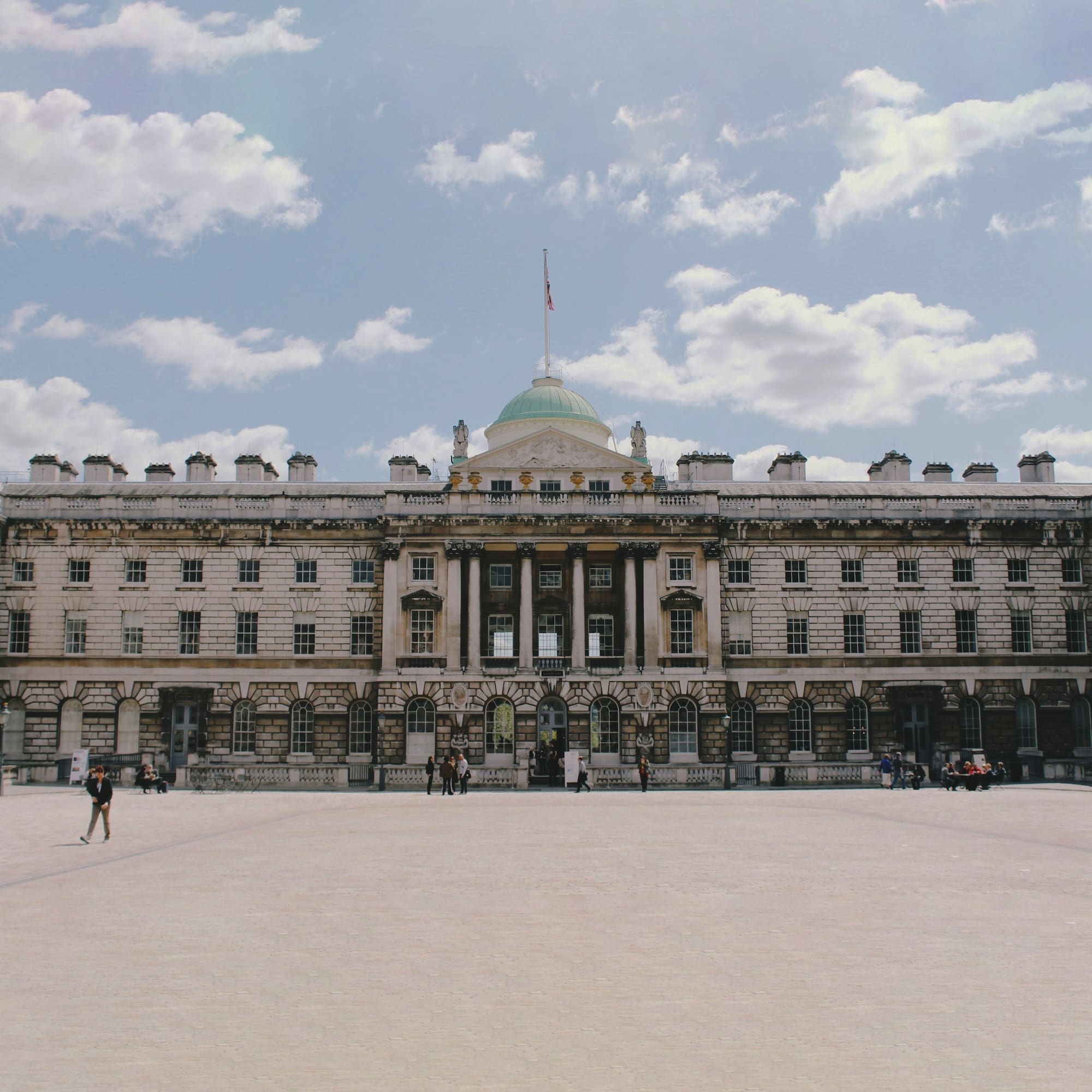 a large building with a flag on top