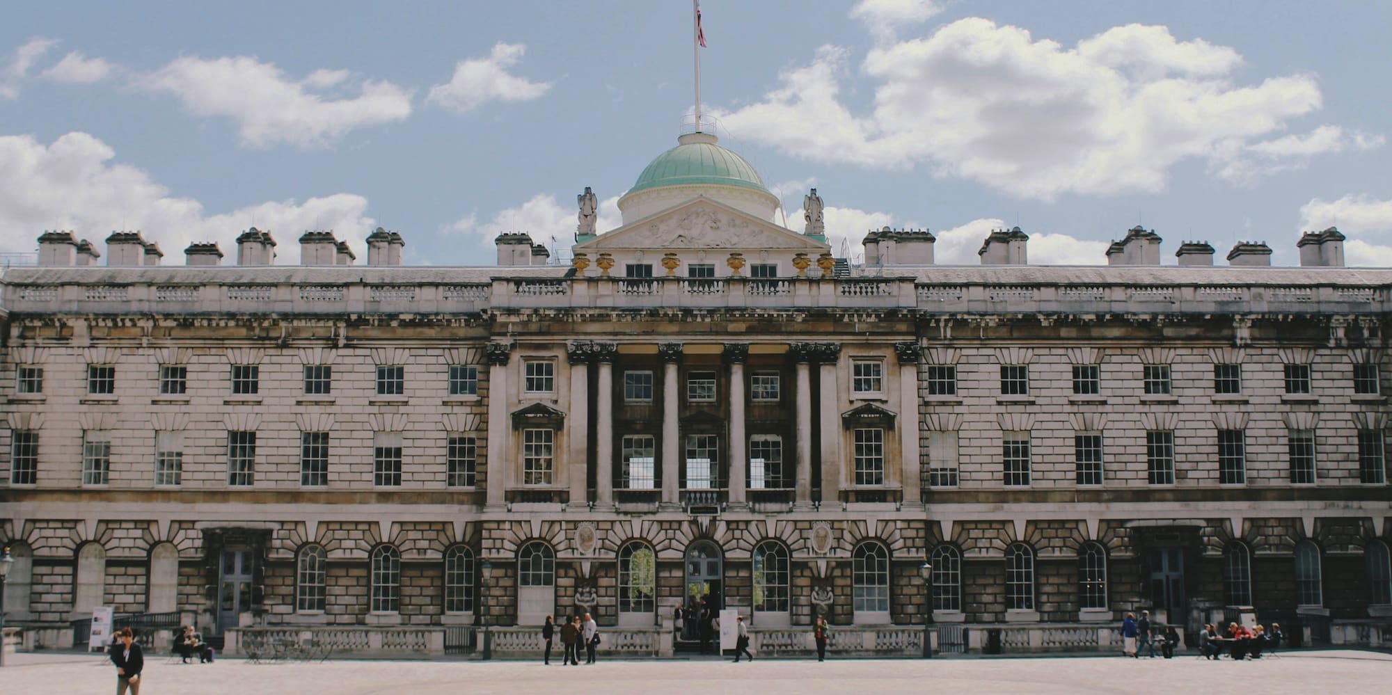 a large building with a flag on top