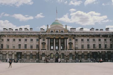 a large building with a flag on top