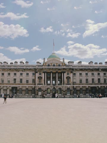 a large building with a flag on top