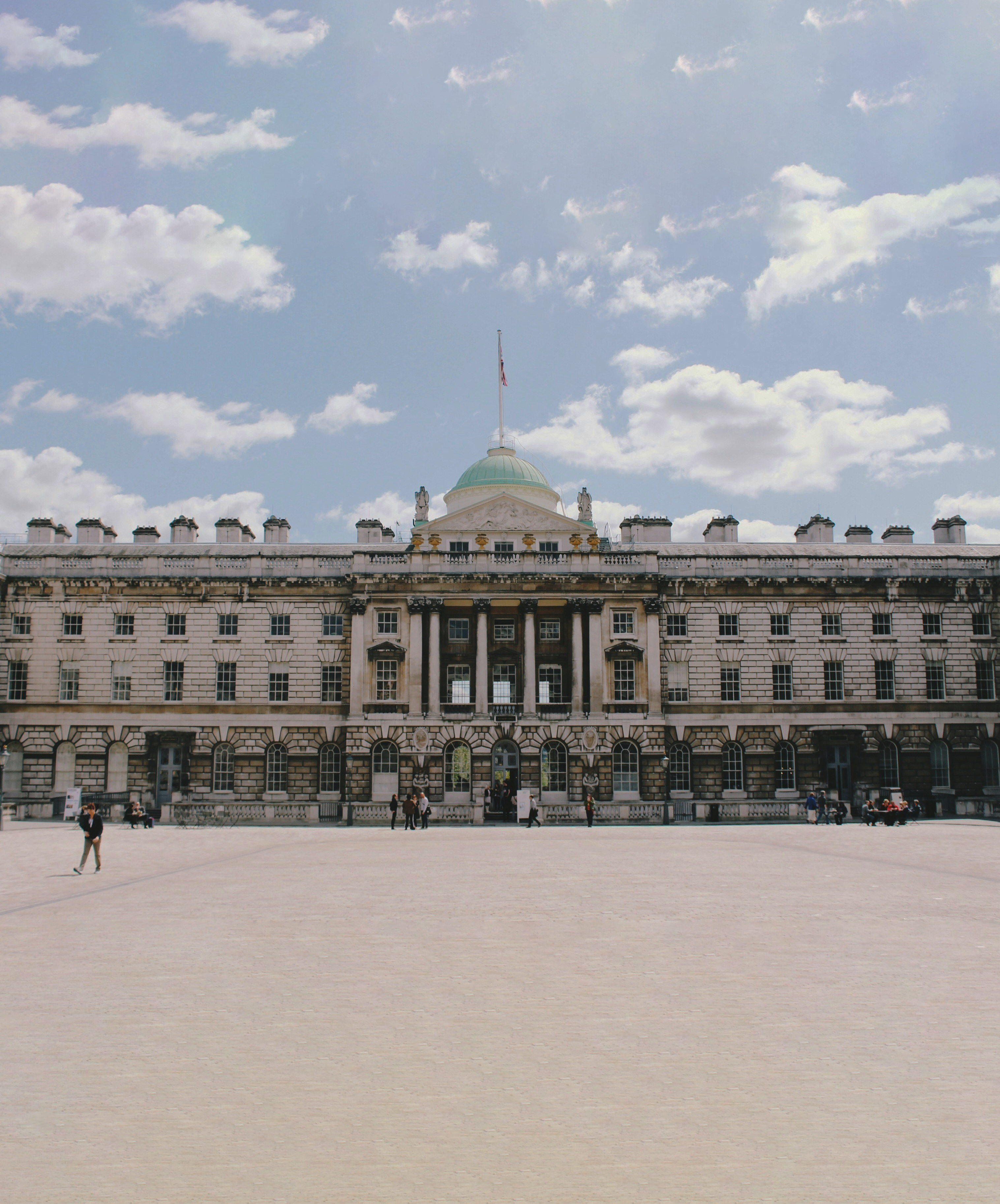 a large building with a flag on top