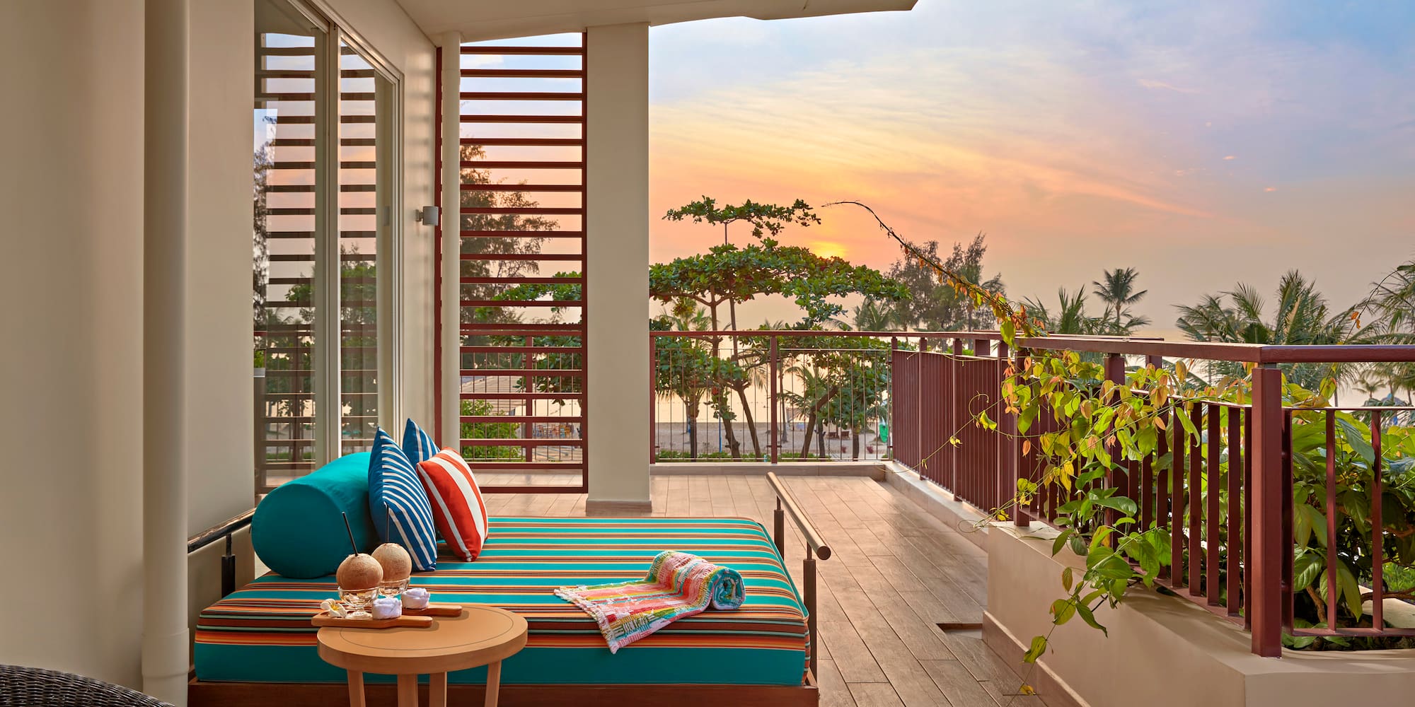 a balcony with a couch and a table