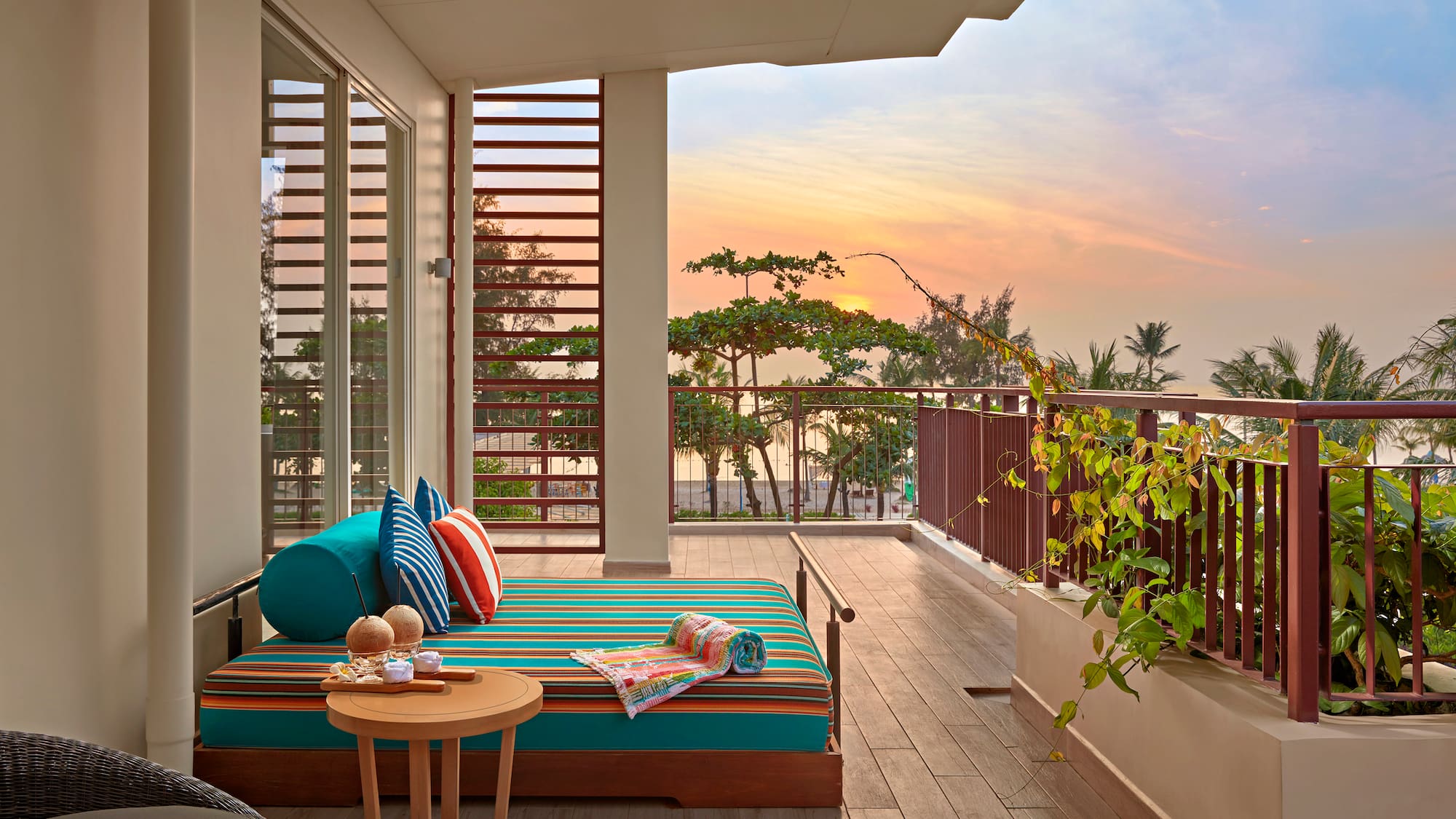 a balcony with a couch and a table