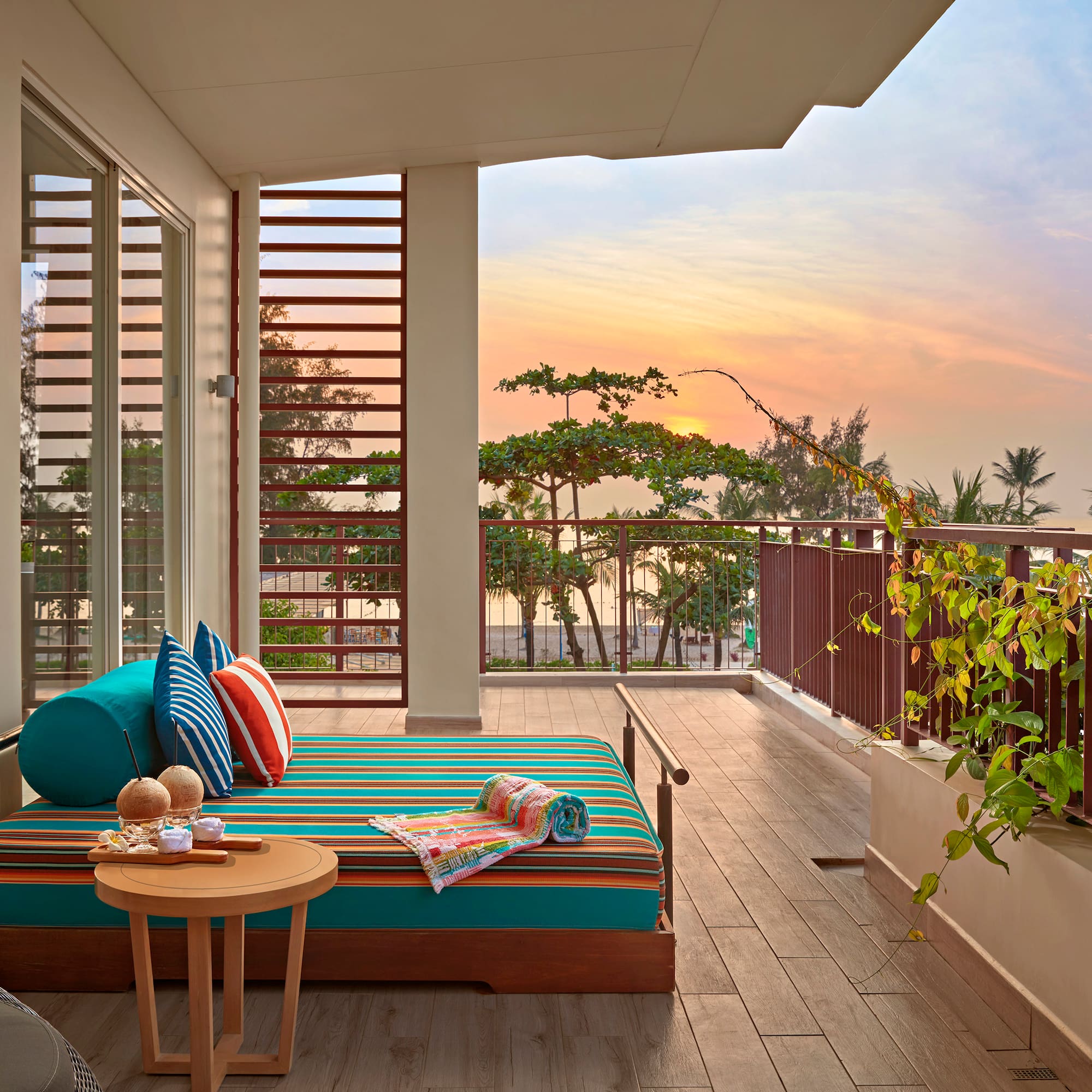 a balcony with a couch and a table