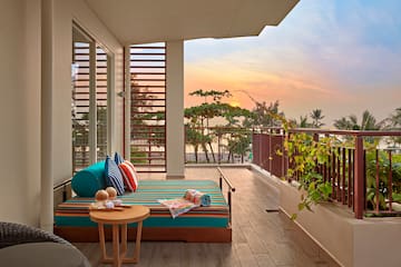 a balcony with a couch and a table