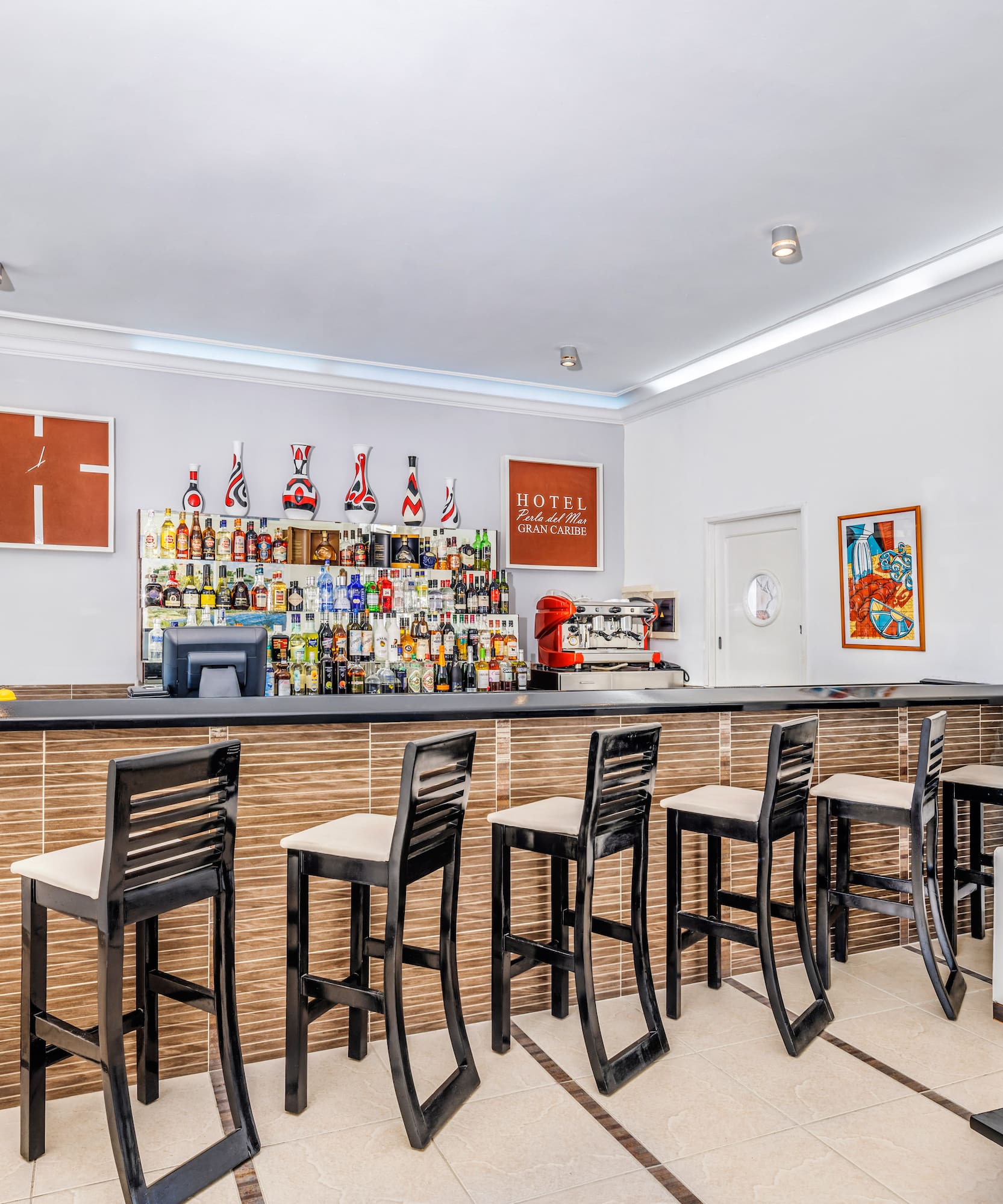 a bar with chairs and a table