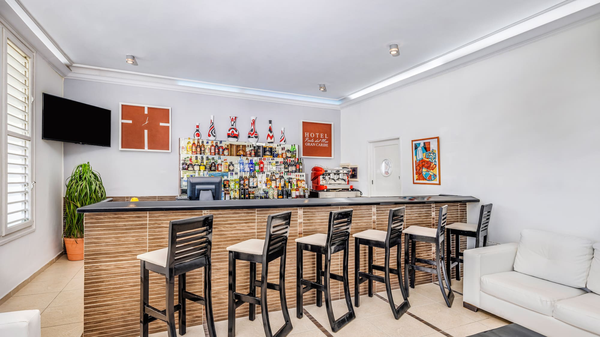 a bar with chairs and a table