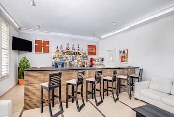 a bar with chairs and a table