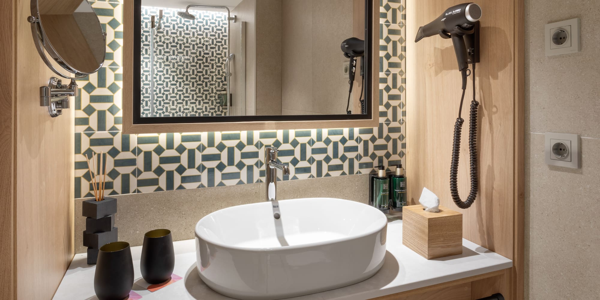 a bathroom with a mirror and sink