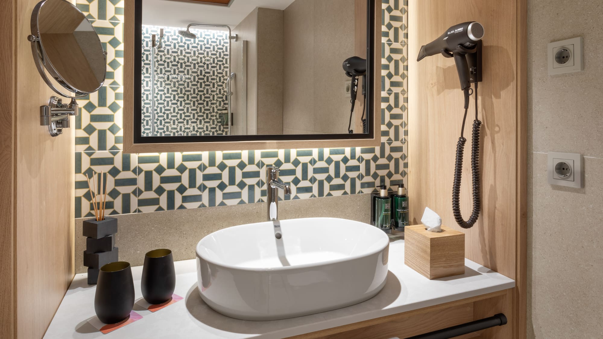 a bathroom with a mirror and sink