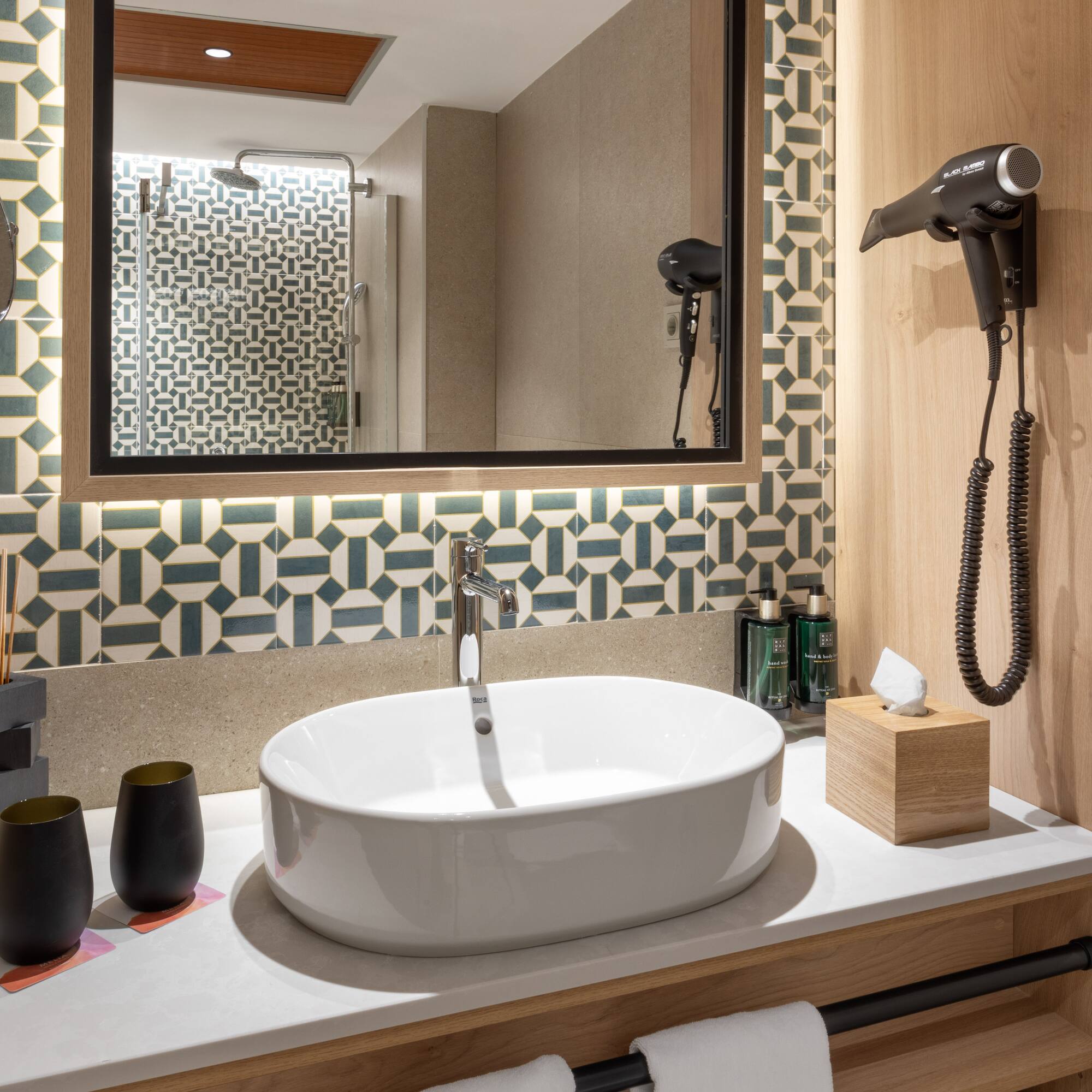 a bathroom with a mirror and sink