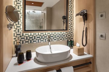 a bathroom with a mirror and sink