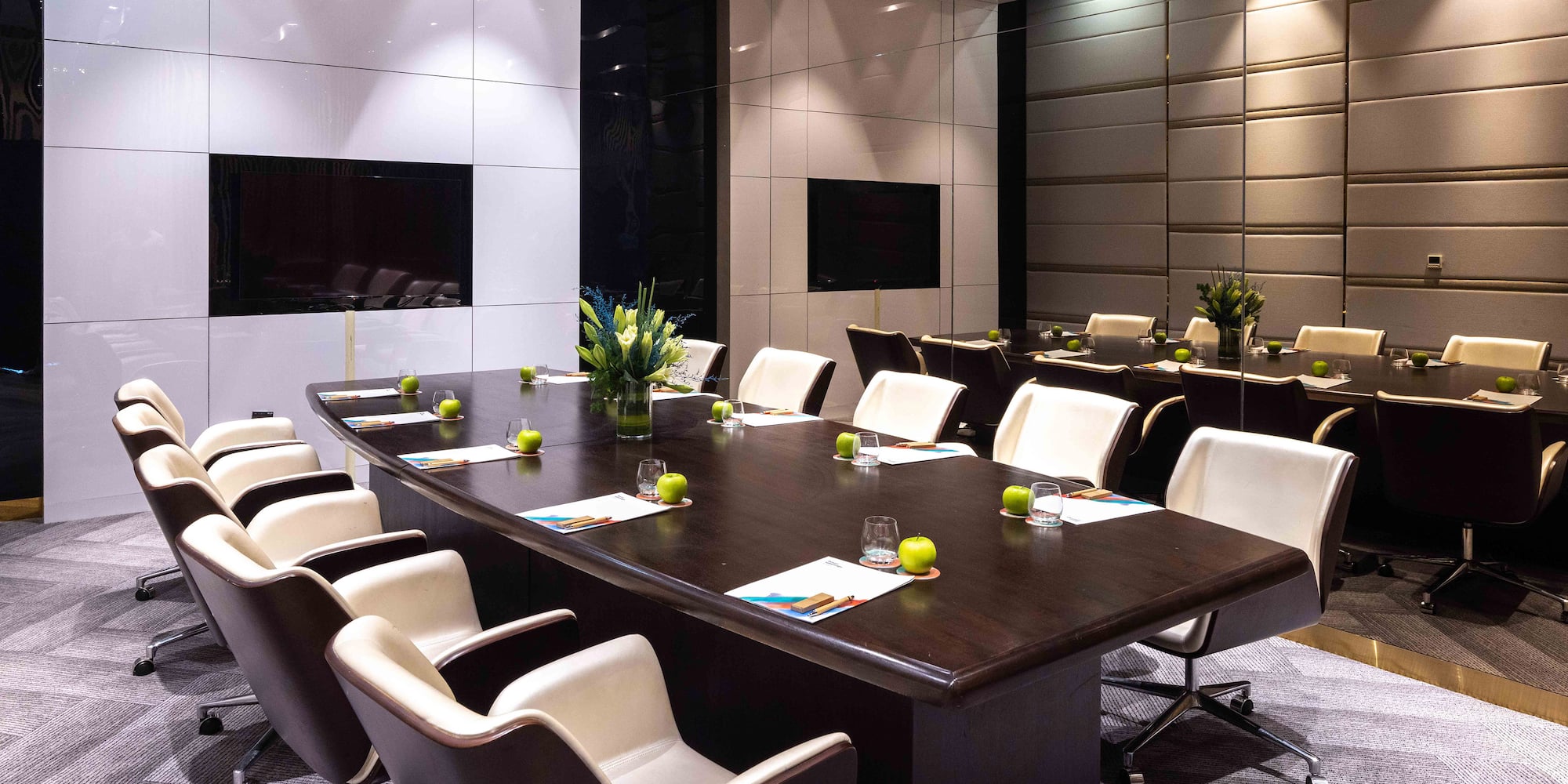 a conference room with a table and chairs