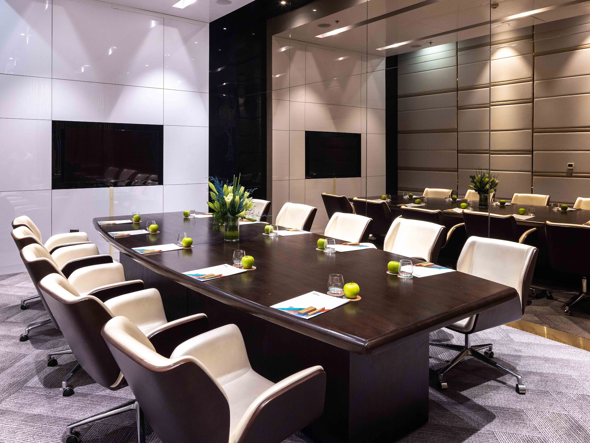 a conference room with a table and chairs