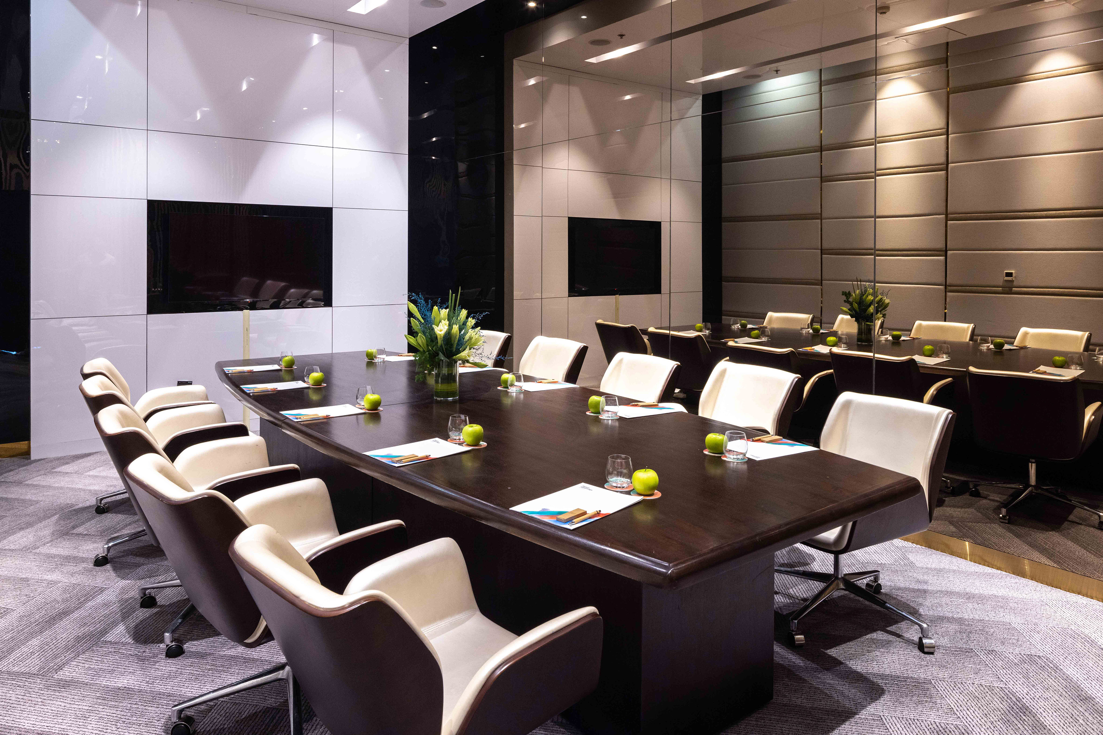 a conference room with a table and chairs