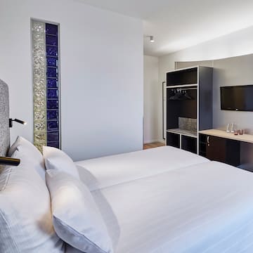 a room with a bed and a tv