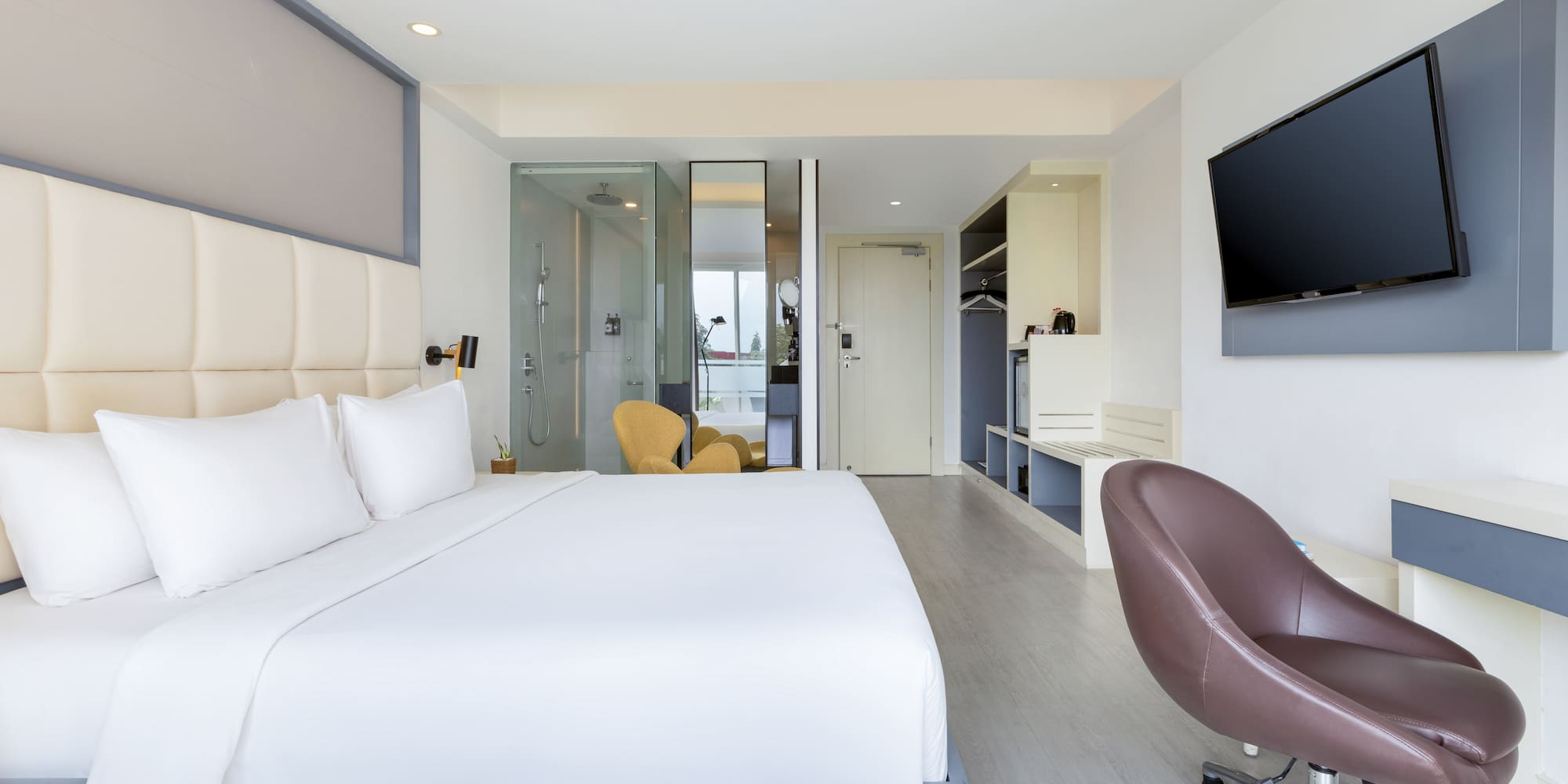 a room with a bed and a tv