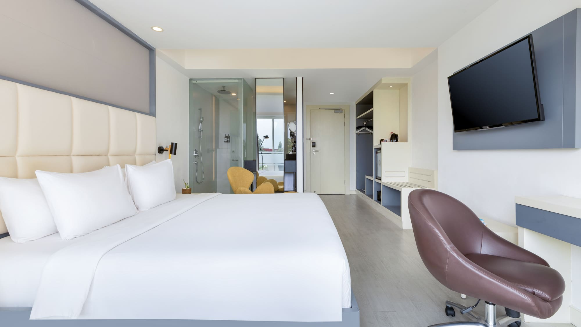 a room with a bed and a tv