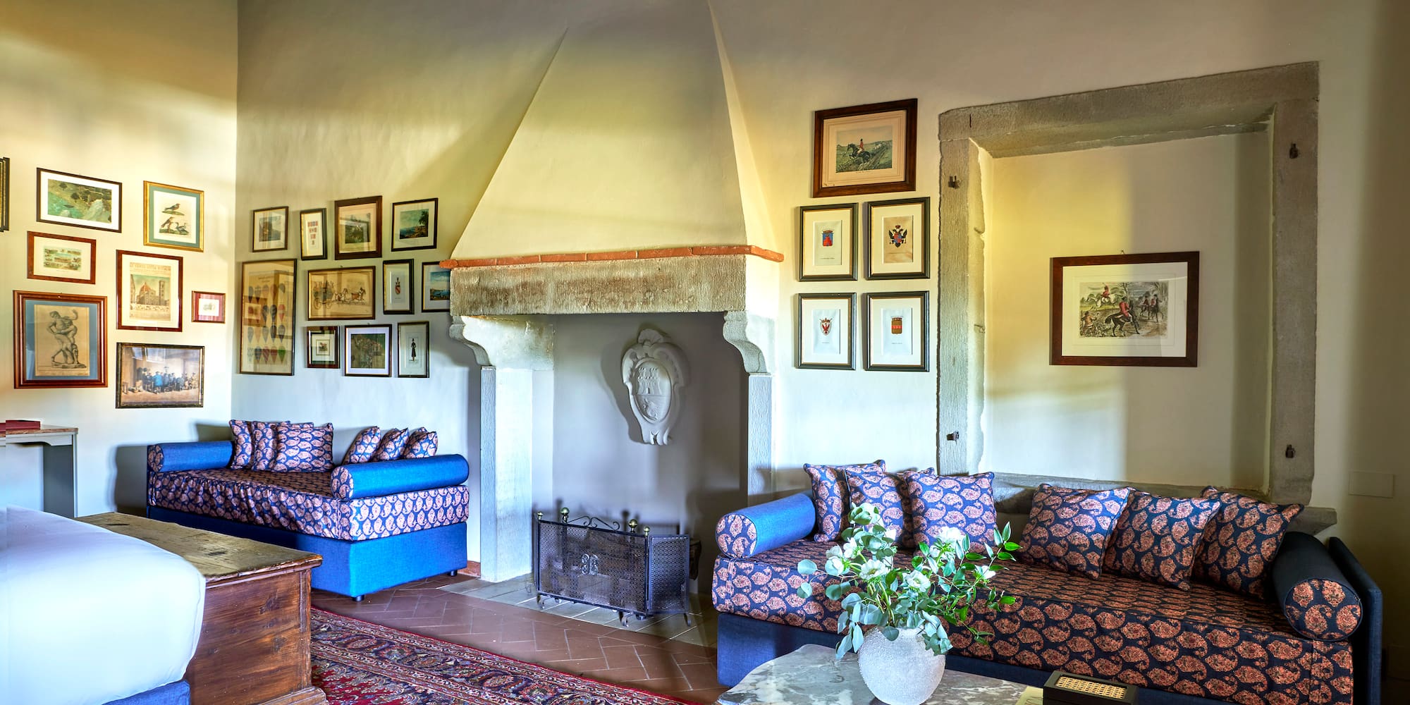 a living room with a fireplace and couches