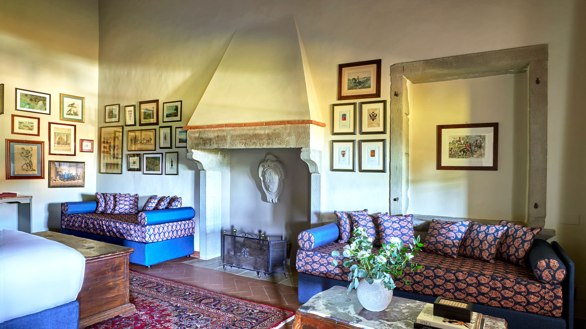 a living room with a fireplace and couches