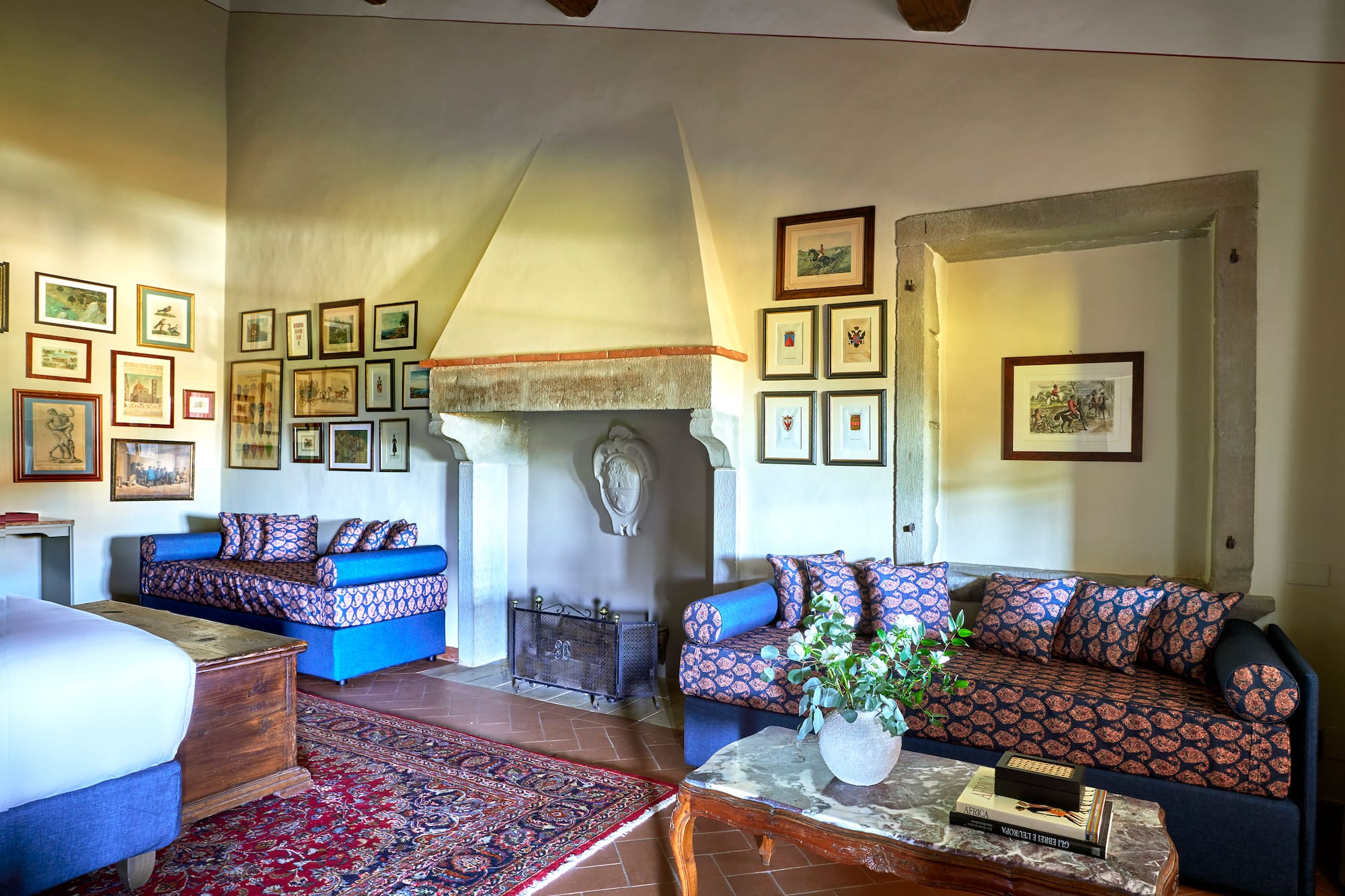 a living room with a fireplace and couches