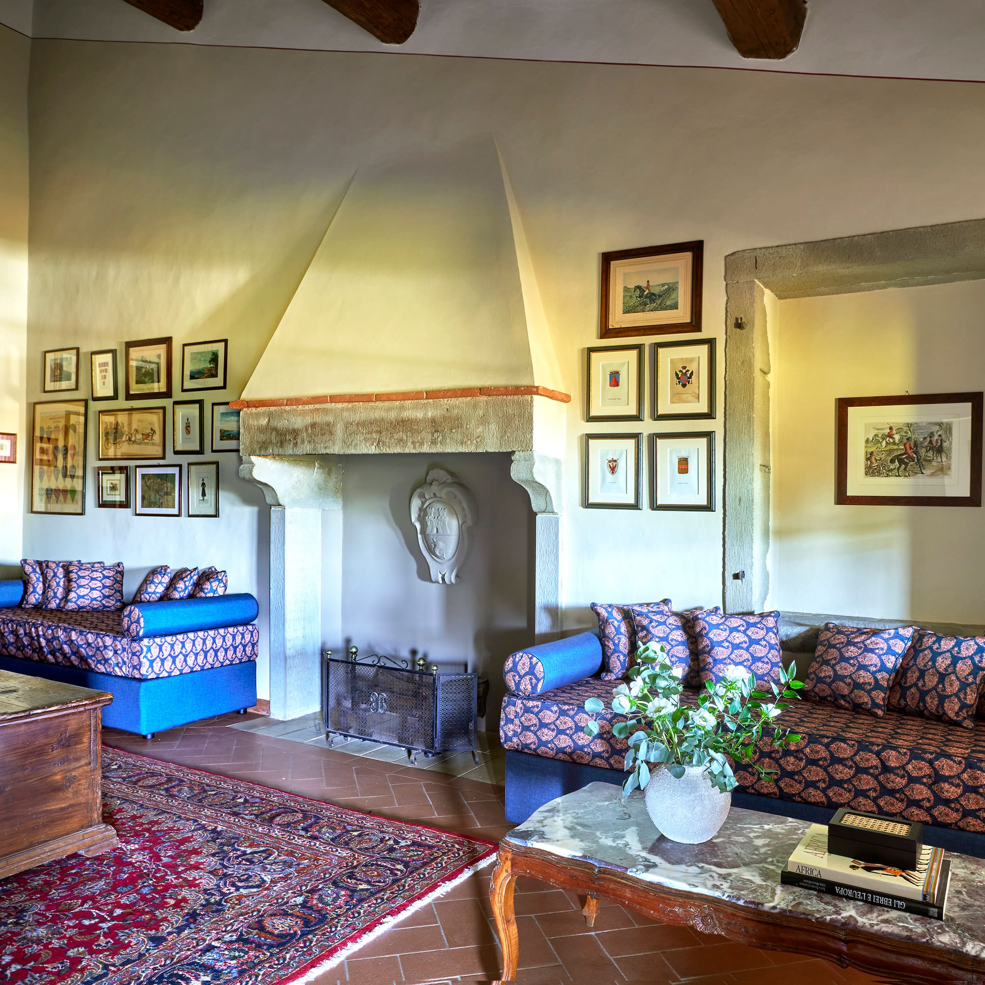 a living room with a fireplace and couches
