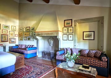 a living room with a fireplace and couches
