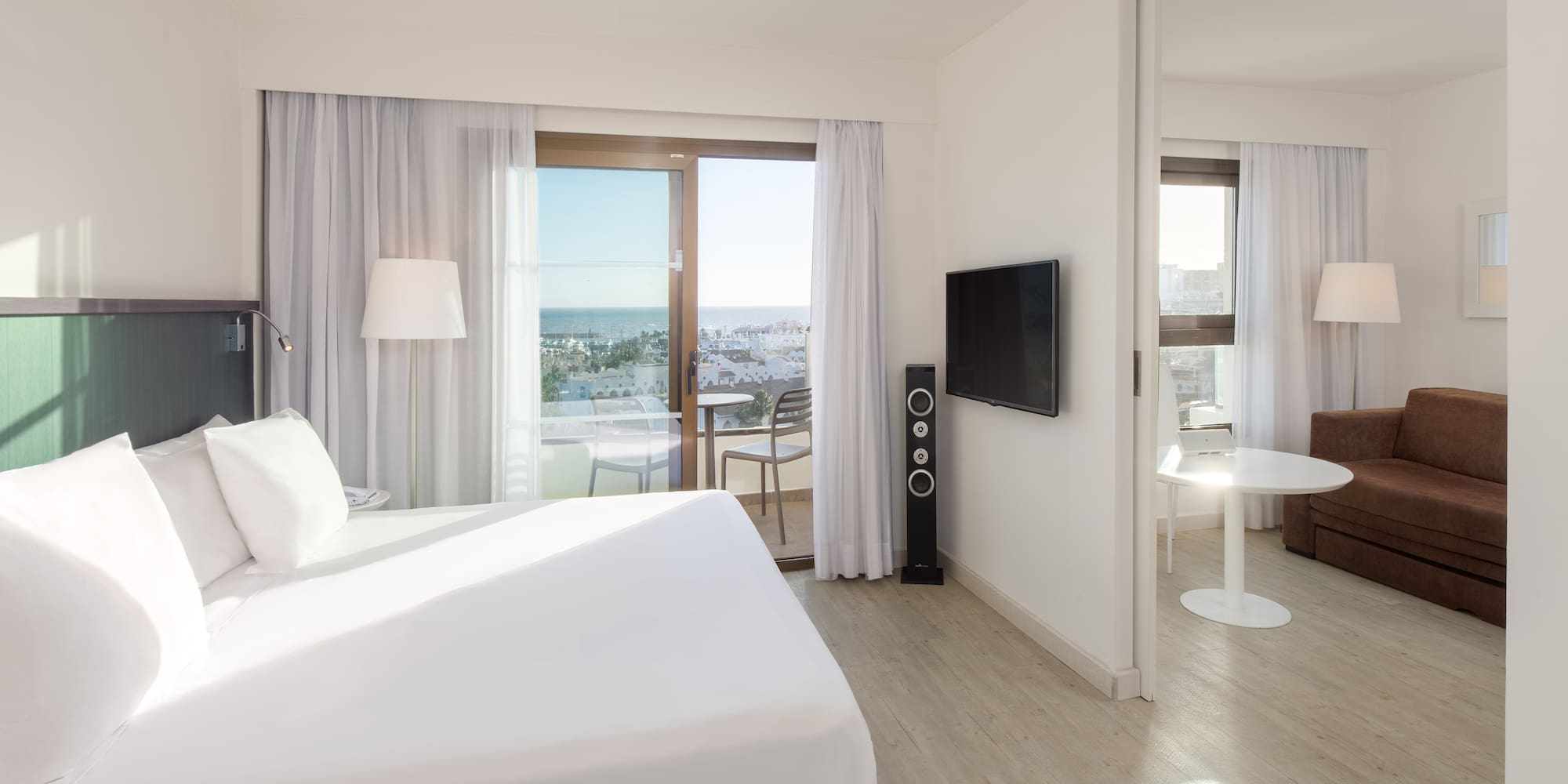 a bedroom with a large bed and a television