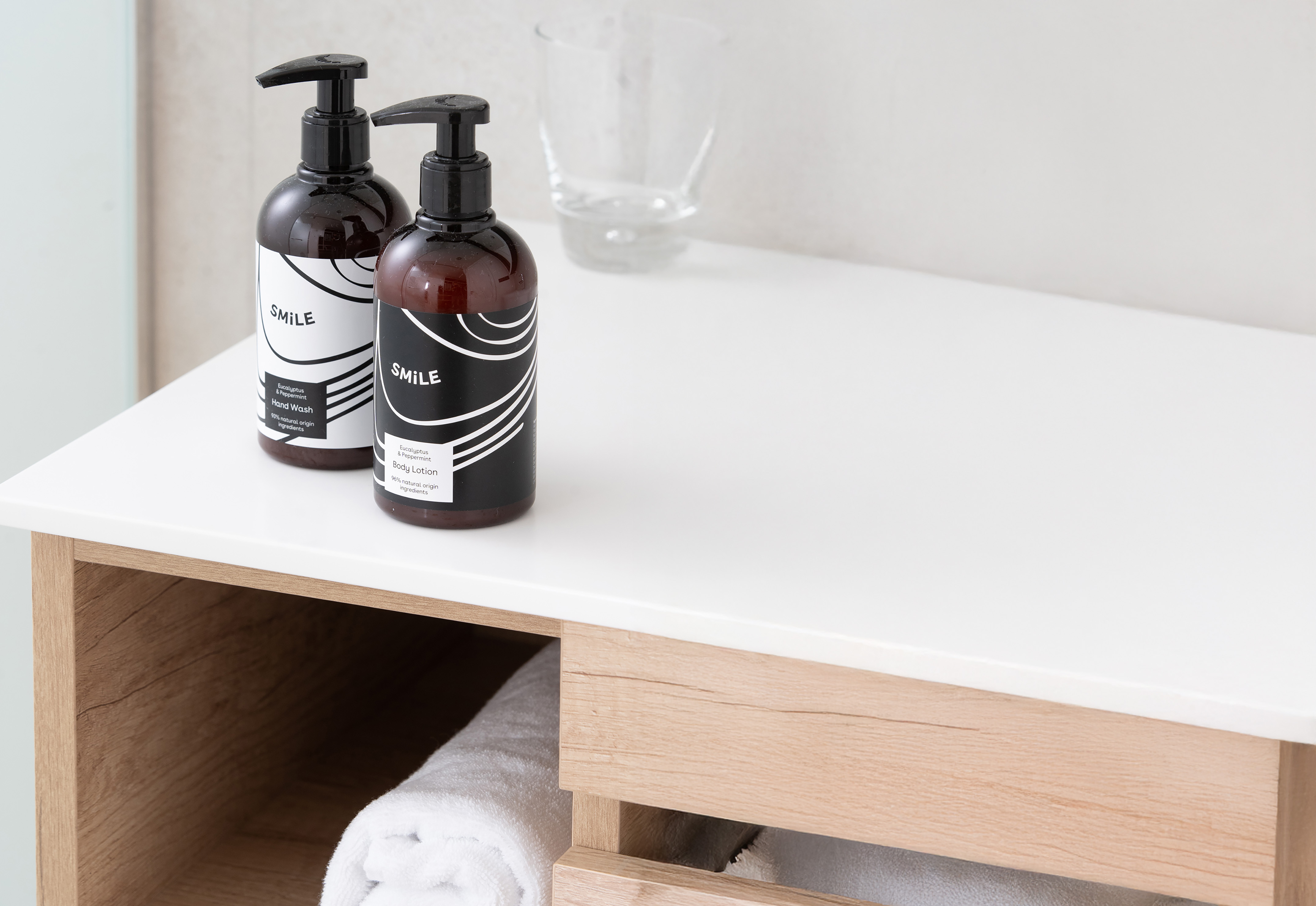 Eucalyptus & Peppermint hand wash and body lotion on bathroom vanity.