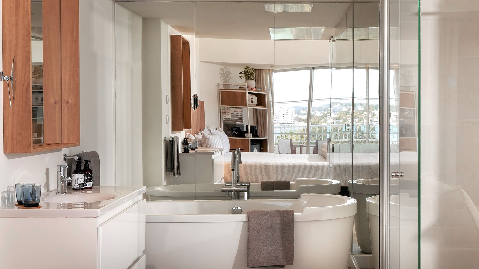 a bathroom with a large glass shower door