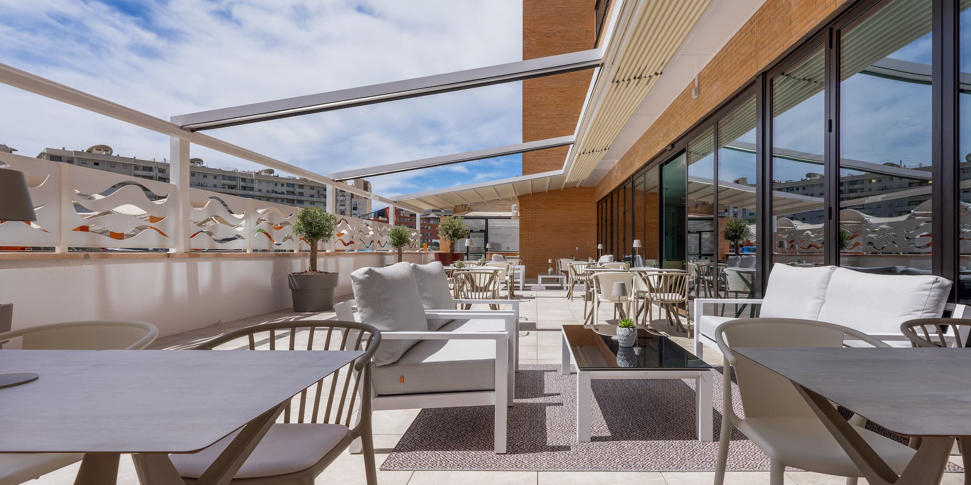 a patio with chairs and tables