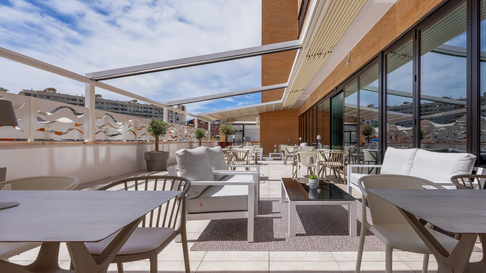 a patio with chairs and tables